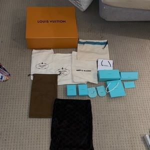 Assortment of dust bags and boxes all designed top designers